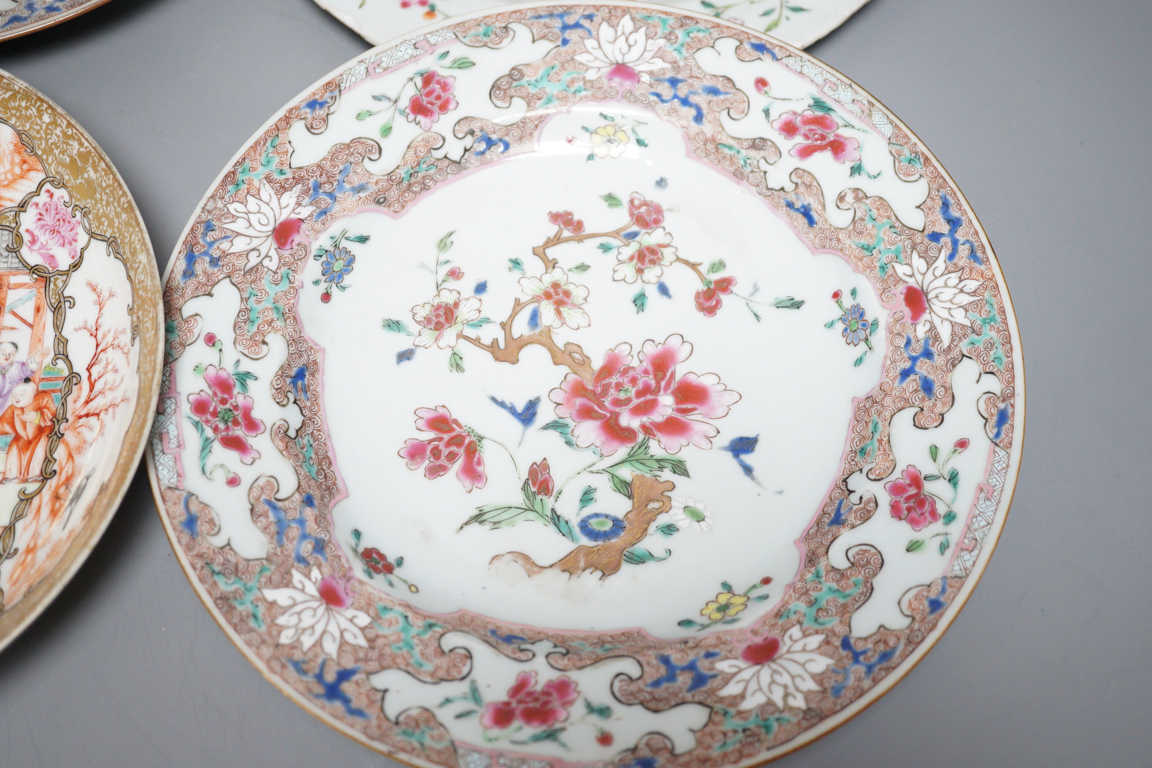 A pair of 18th century Chinese export famille rose plates and two others, largest 23cm